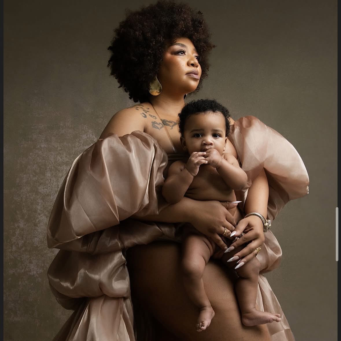 Crown Revival founder Chelsea holding her son Saint